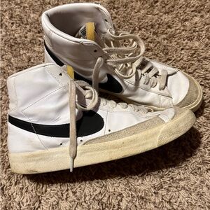 Nike White High-Top Sneakers with Black Swoosh and Yellow Tongue